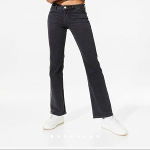 Divided dark gray low rise flared leg jeans